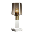 L' afbeelding toont een elegante tafellamp met een modern ontwerp. 

**Technische Titel in het Nederlands:** 
**Moderne tafellamp met glazen kap en gouden details**